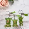 Porte clé en résine - idées cadeaux - boutique en ligne - Ourson vert clair paillettes boutique idées cadeaux - boutique en ligne - création française et artisanale.