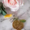 Boutique en ligne d'idées cadeaux et de décoration pour la fête des mères, la fêtes des pères ou pour un anniversaire enfant ou adulte, pour les fêtes de Noël ou pour tout autre occasion Porte-clés diamant pomme - Résine - Doré vert